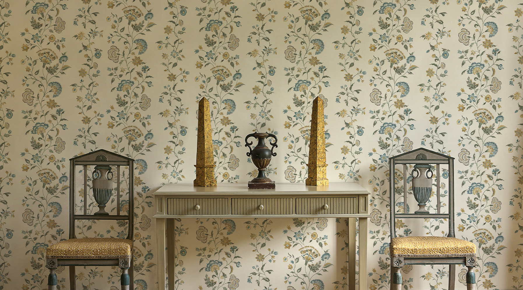 Victoria floral stripe wallpaper in room with console and chairs