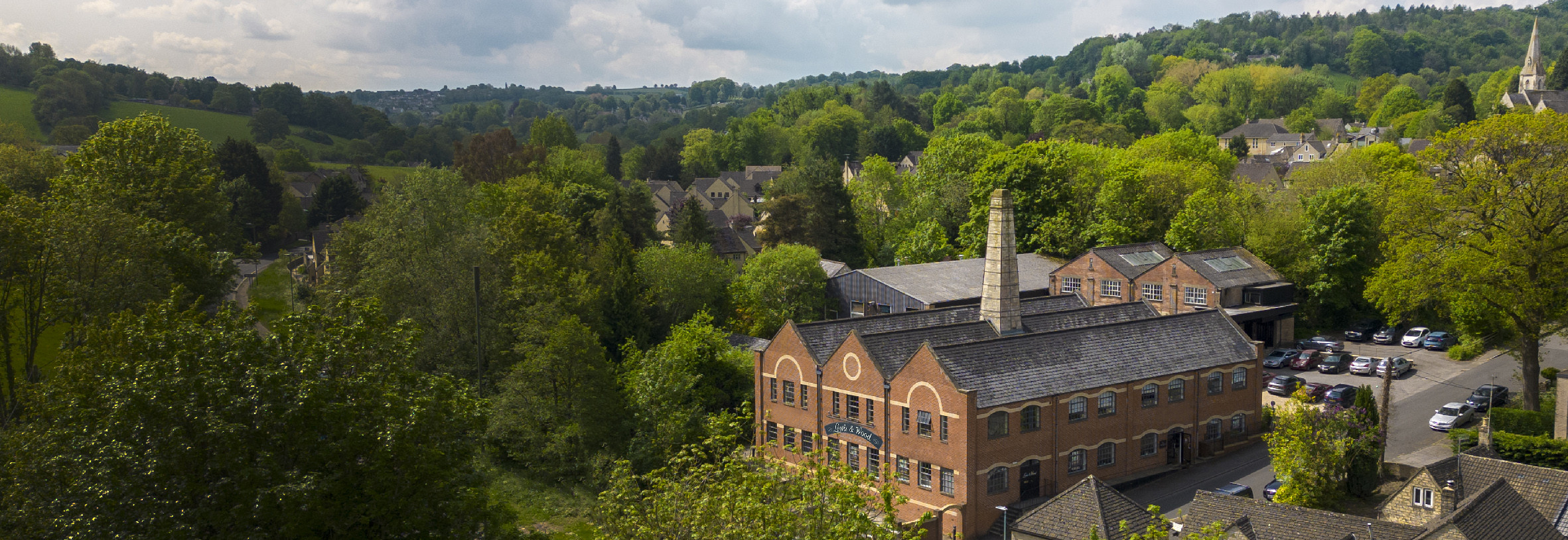 aerial shot lewis and wood mill in cotswolds