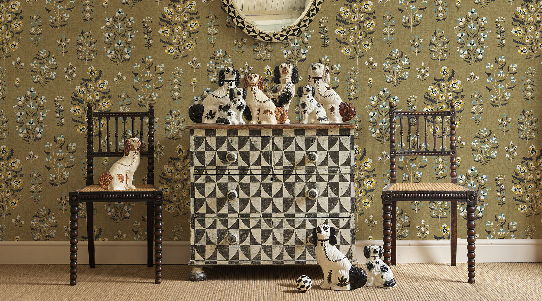Lara wallpaper in living room, with chest of drawers and porcelain dogs