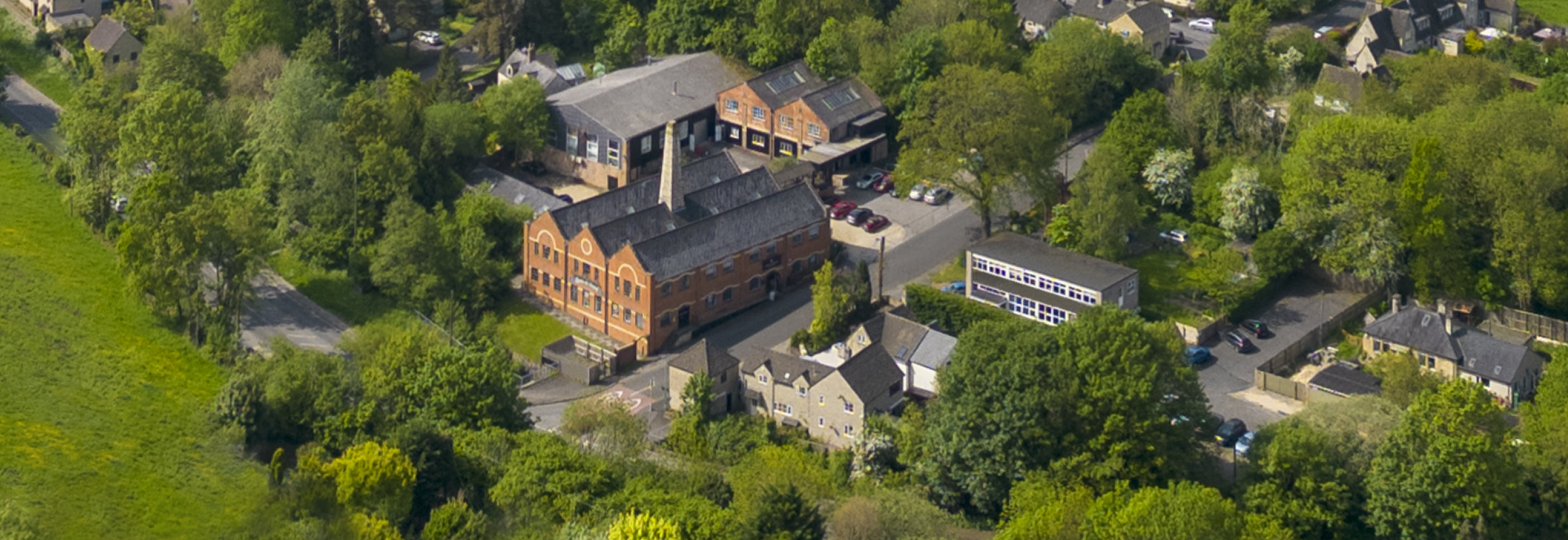 aerial shot lewis and wood mill in cotswolds