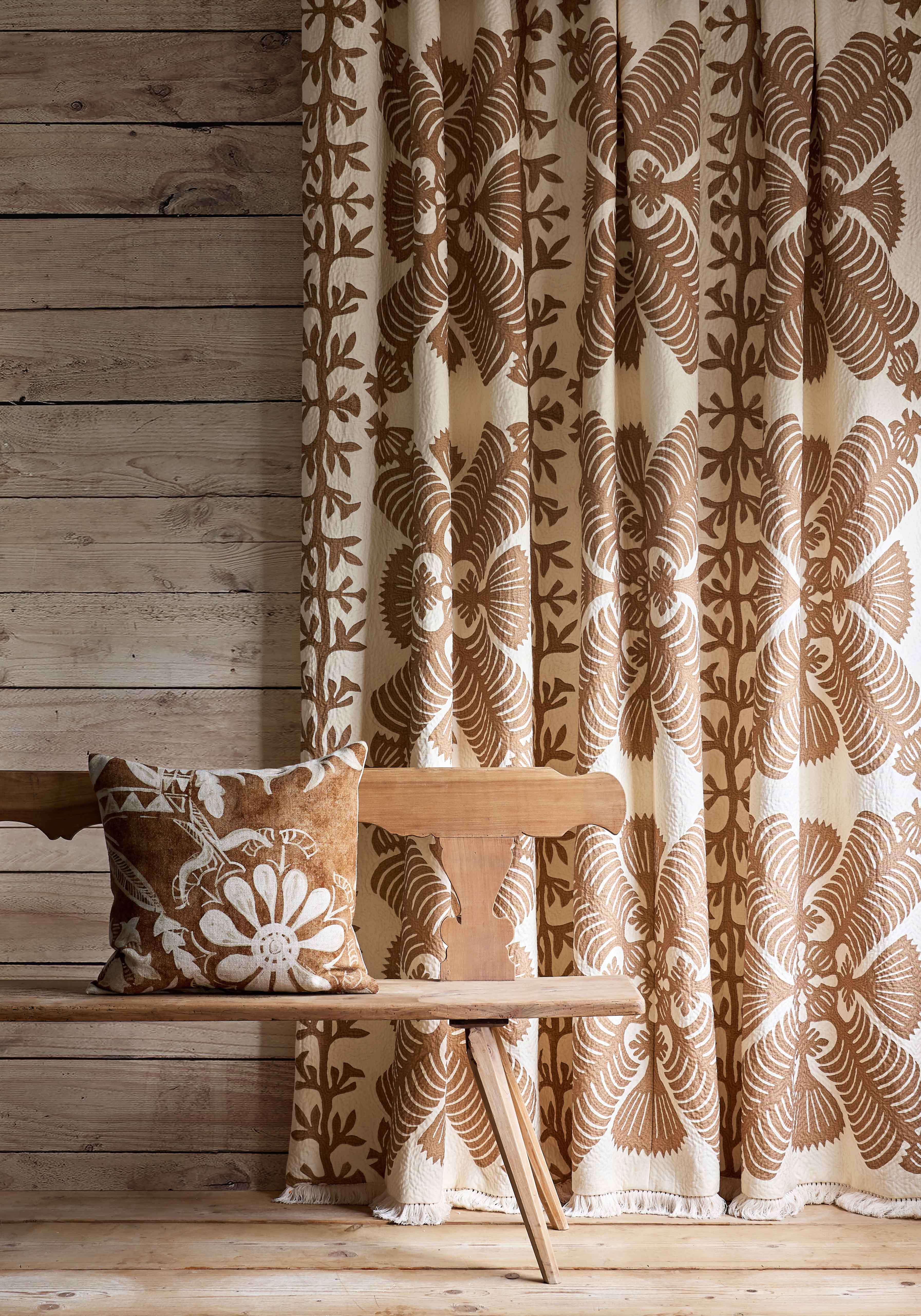 hawaiian sandalwood curtain with Womad cushion on bench, lewis and wood